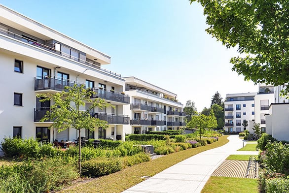 apartment-trees-sidewalk-IS-1161036960