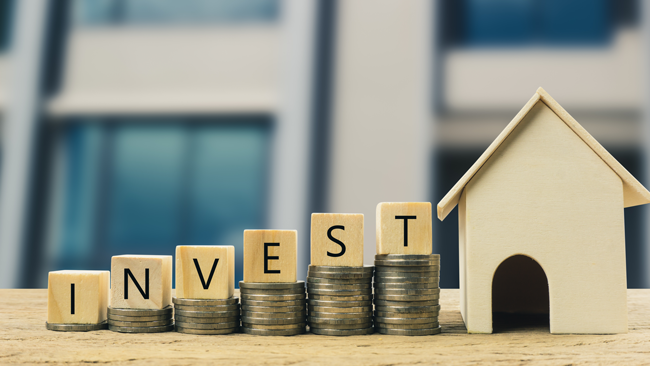 coins-stacking-to-house-invest-in-real-estate-AS-265319498