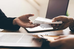 handing-money-document-IS-1194395178