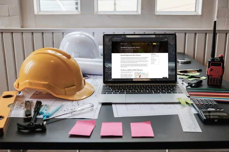 hard-hats-laptop-sticky-notes-IS-1174841527