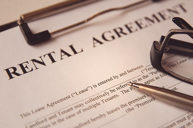 rental-agreement-clipboard-pen-glasses-IS-1156749865