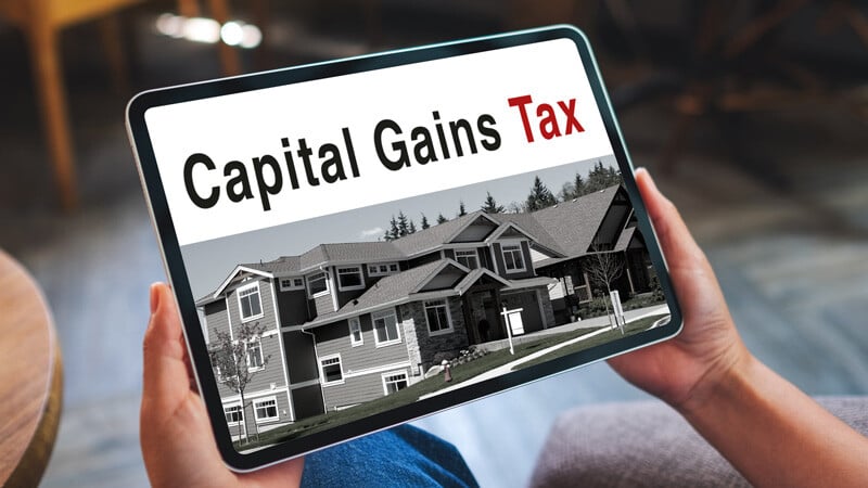 A tablet with the words Capital Gains Tax on it
