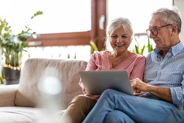 couple-laptop-smiling-IS-1211846360
