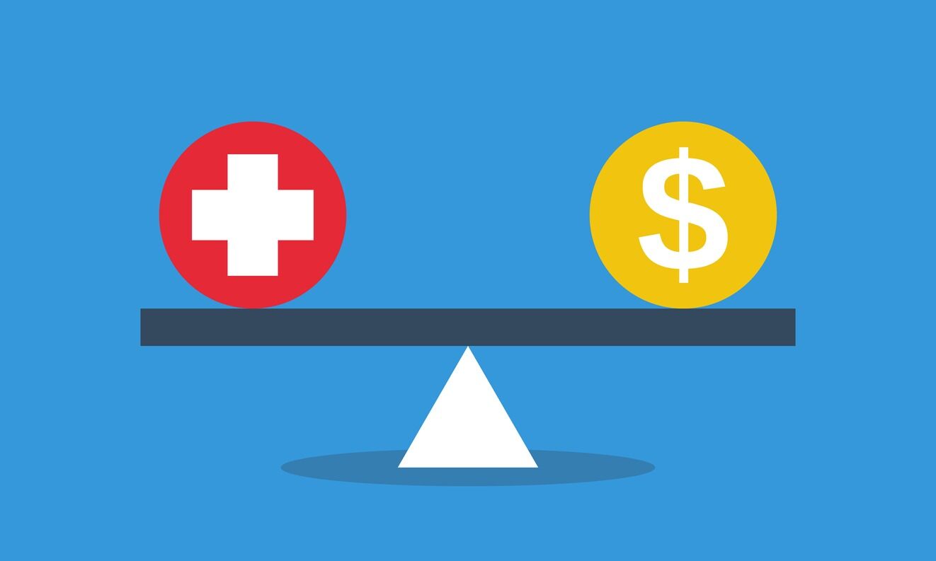 A balance beam with a health sign on the left and money sign on the right.