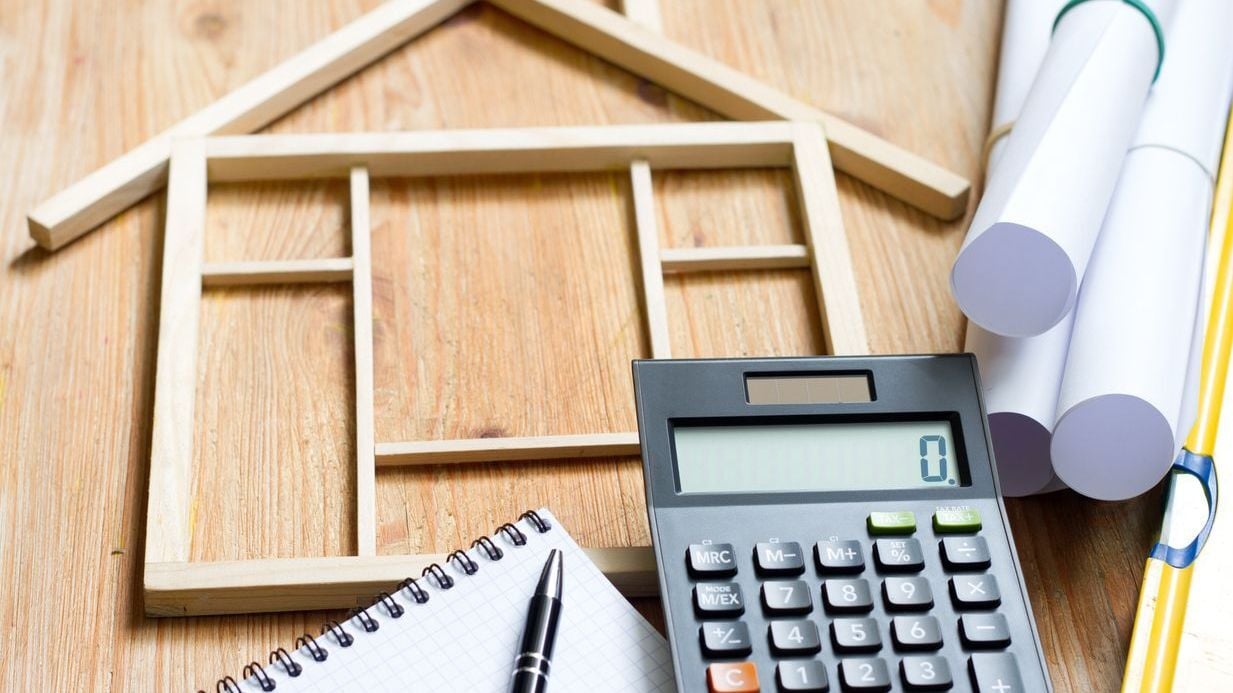 Remodeling construction valuation of home renovation abstract with calculator and plans.