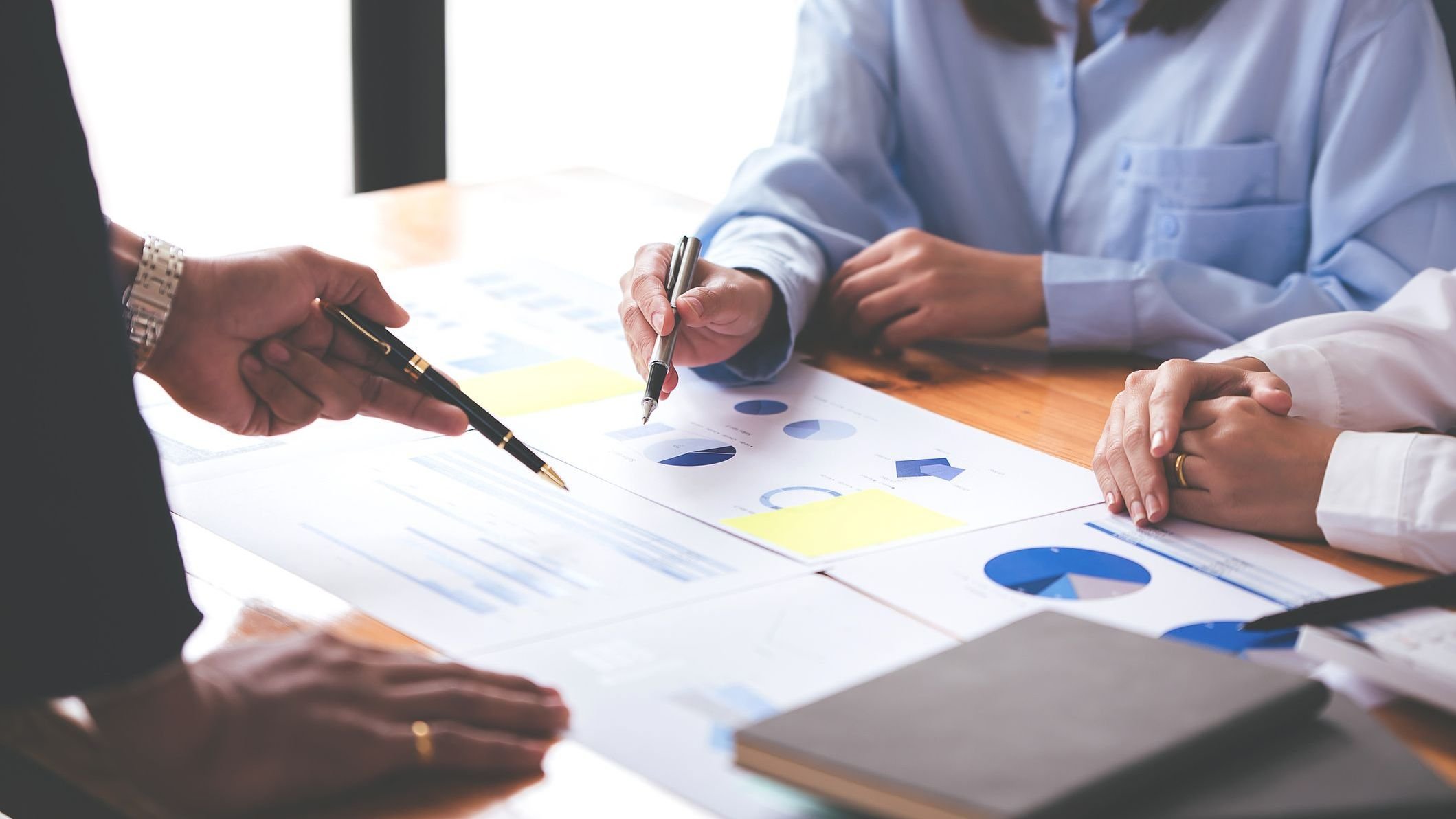 Team work with business analytic price chart on the table at the conference room. 