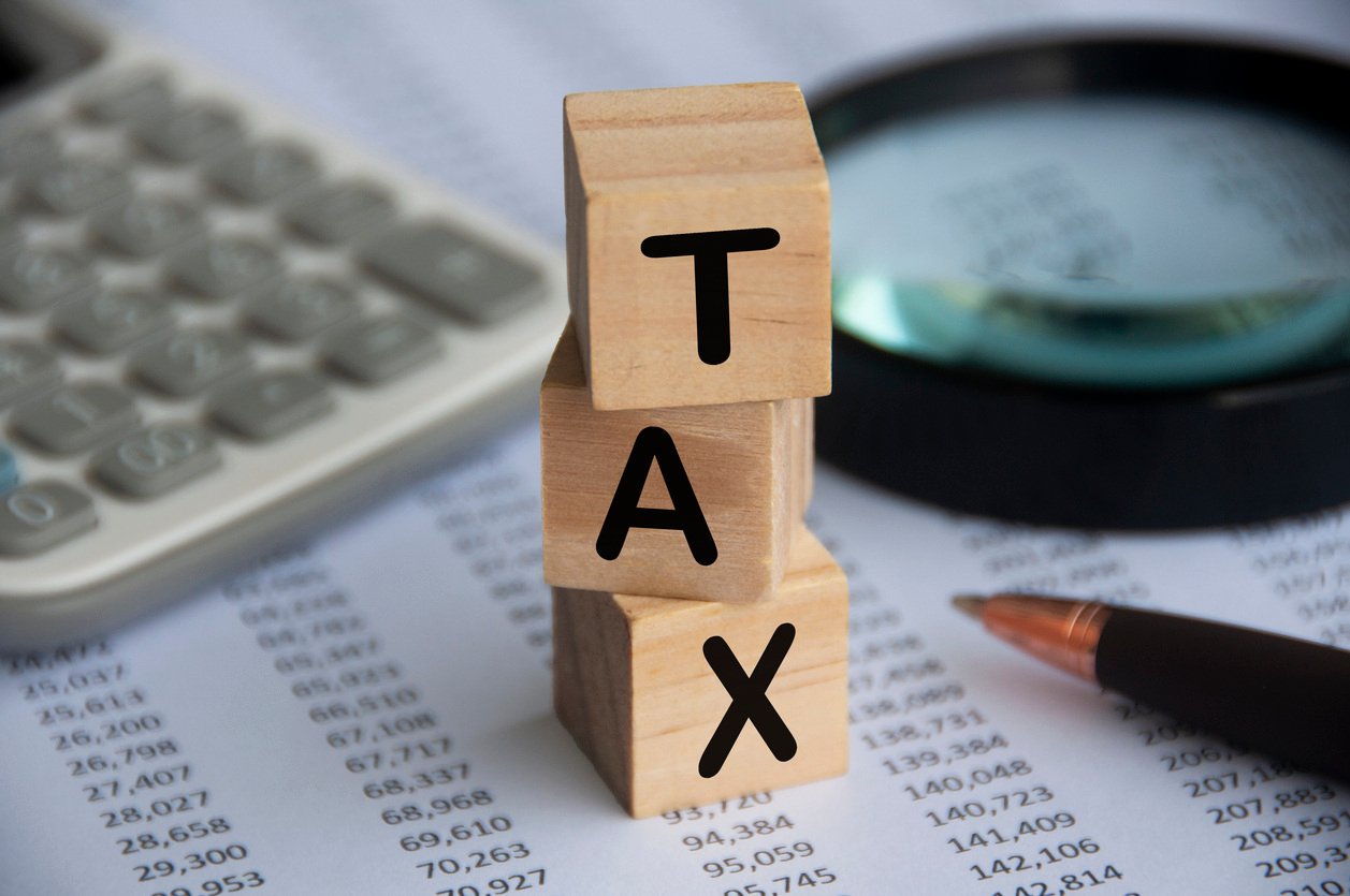 Tax spelt out in wooden blocks.