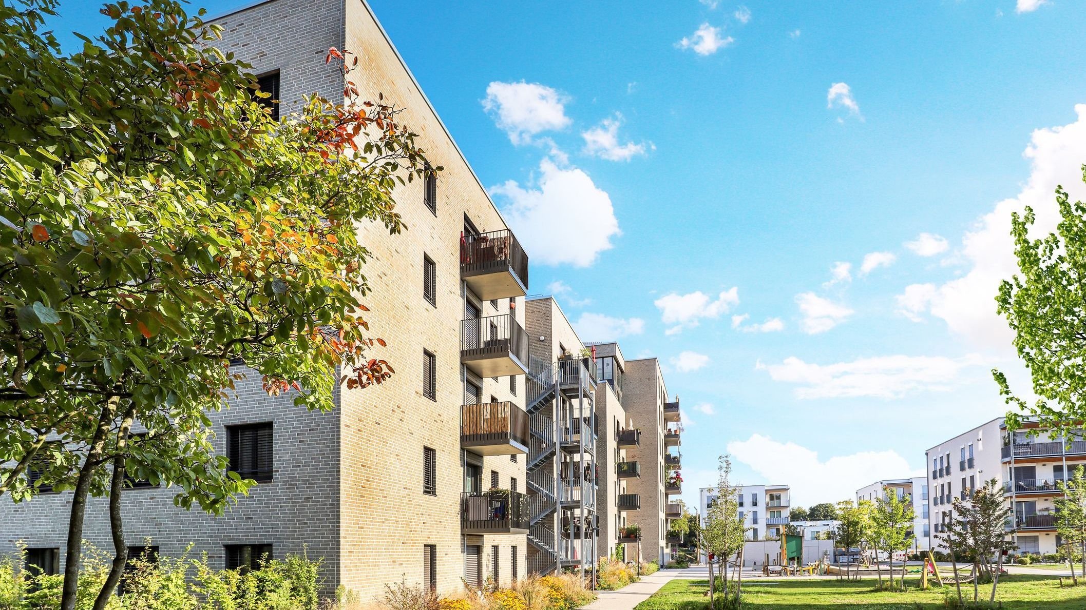 Cityscape of a residential area with modern apartment buildings.
