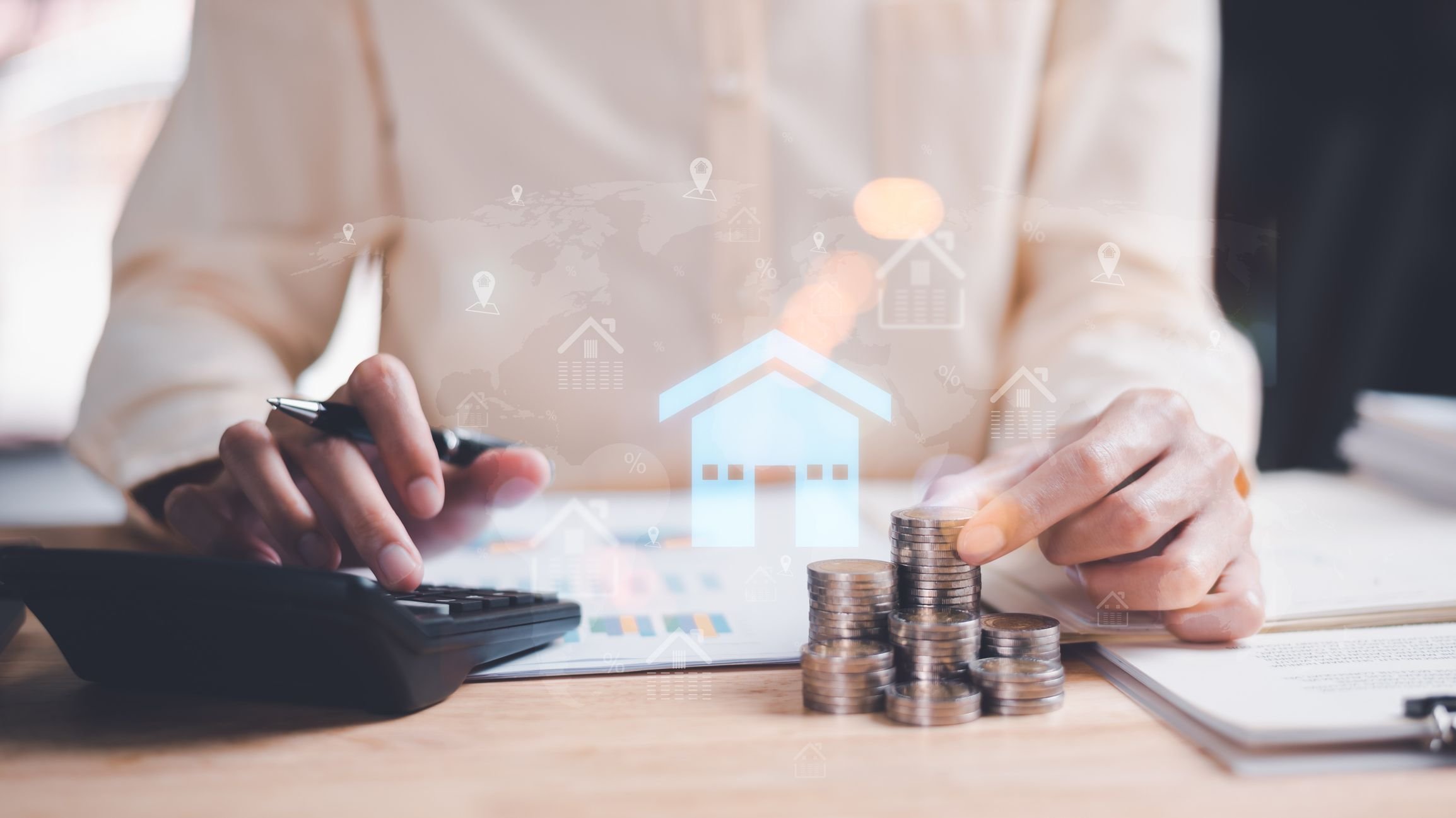Man holding coin and use calculator to calculate.