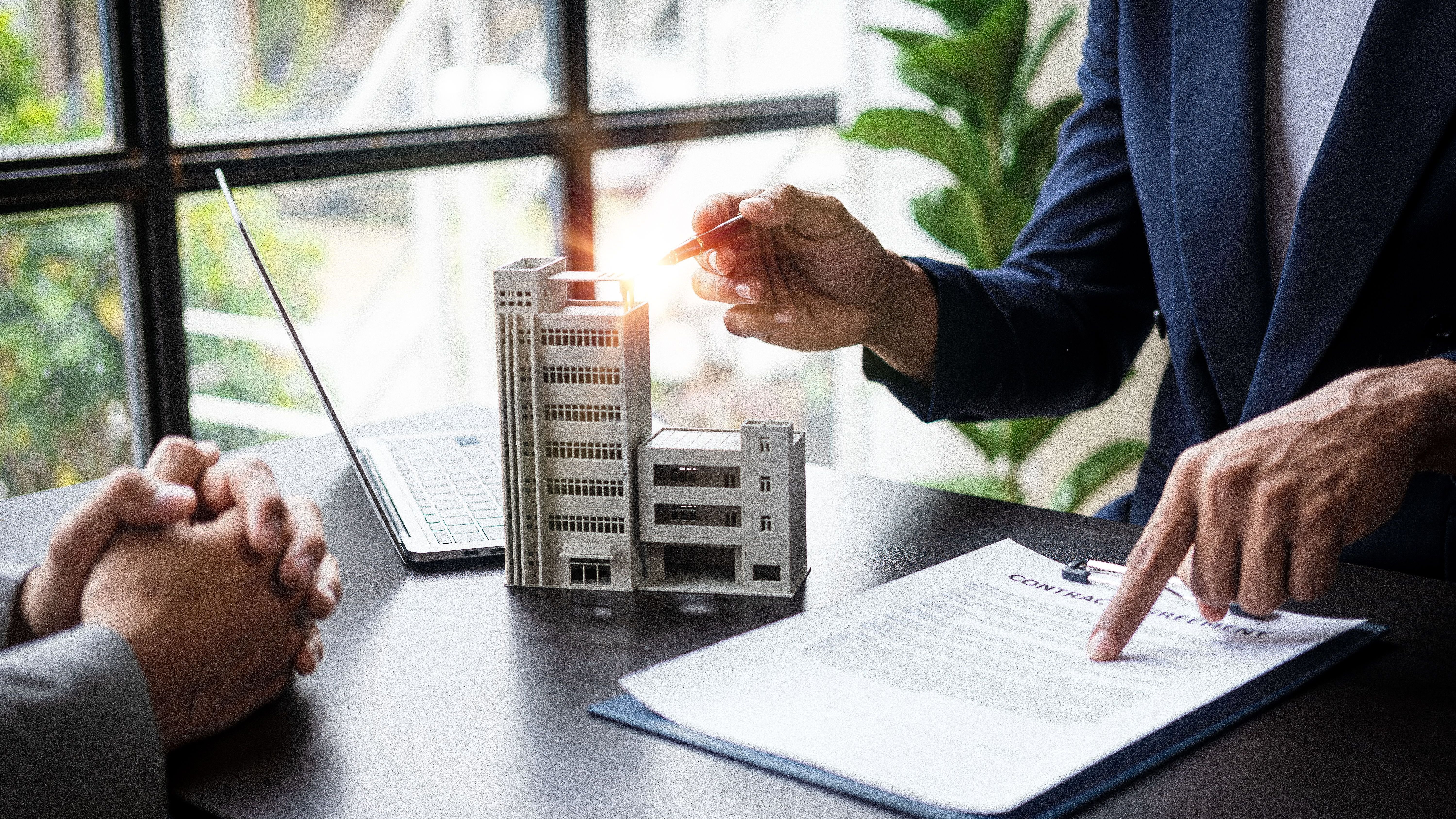 Search millions of premium-quality stock images and videos Search by image or video Real estate agents recommend interest rates, discuss the terms of the home purchase agreement, and ask clients to sign paperwork to legalize the contract.