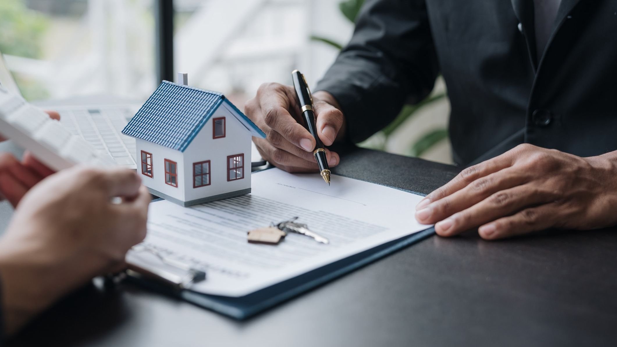 An entrepreneur, business owner, accountant, and young real estate agent who uses home-buying budget calculator calculate the financial risks for clients before signing a deal.