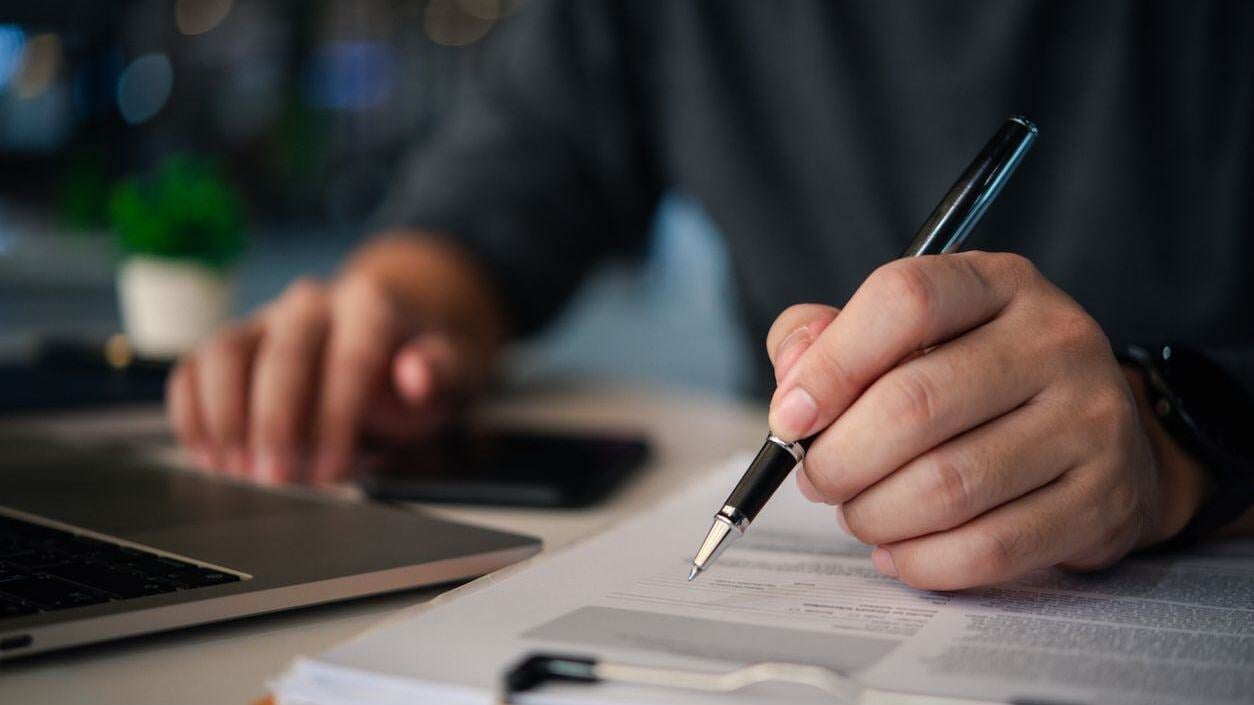 A person looking over papers.