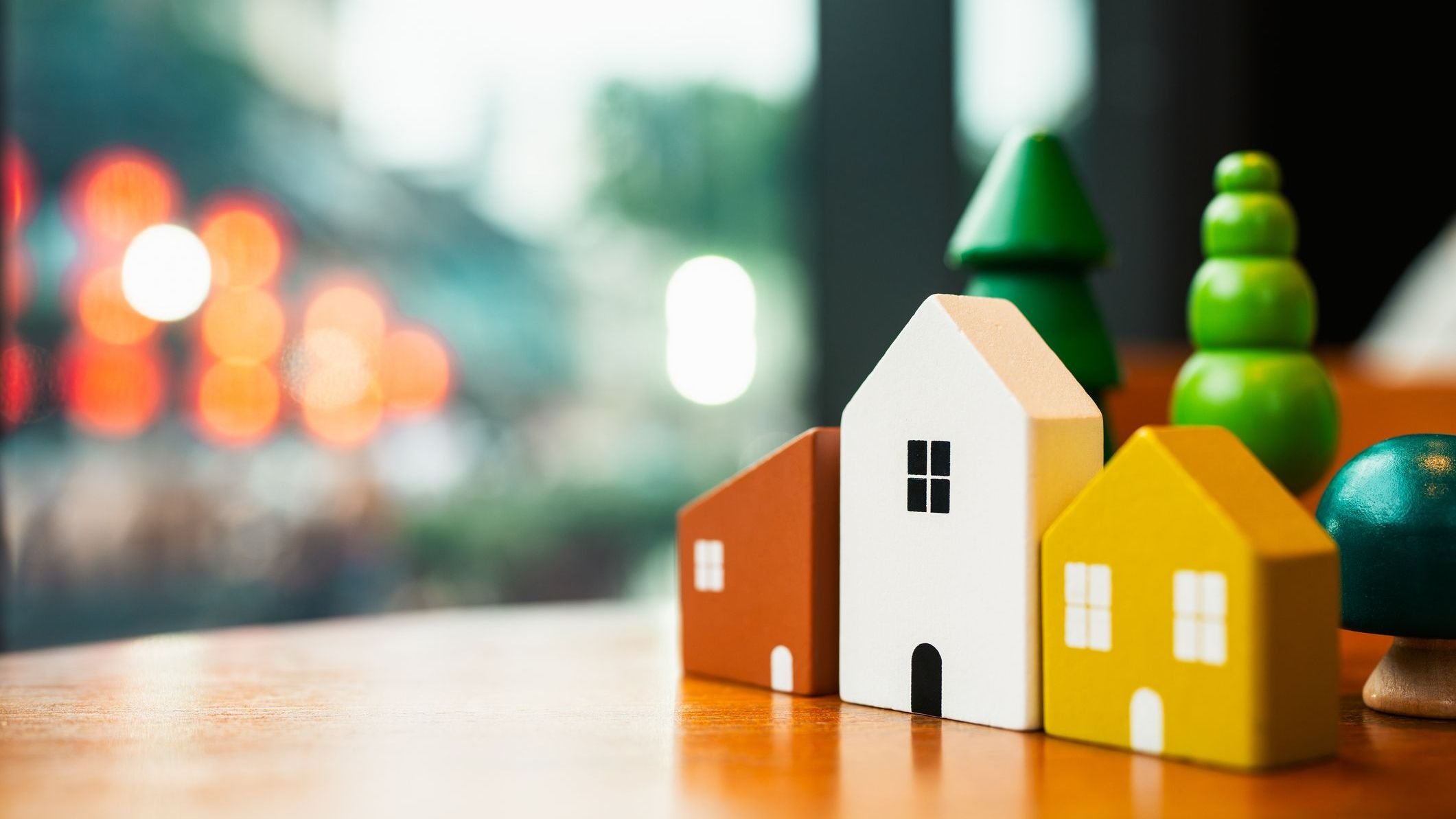 Wooden house model on wood background