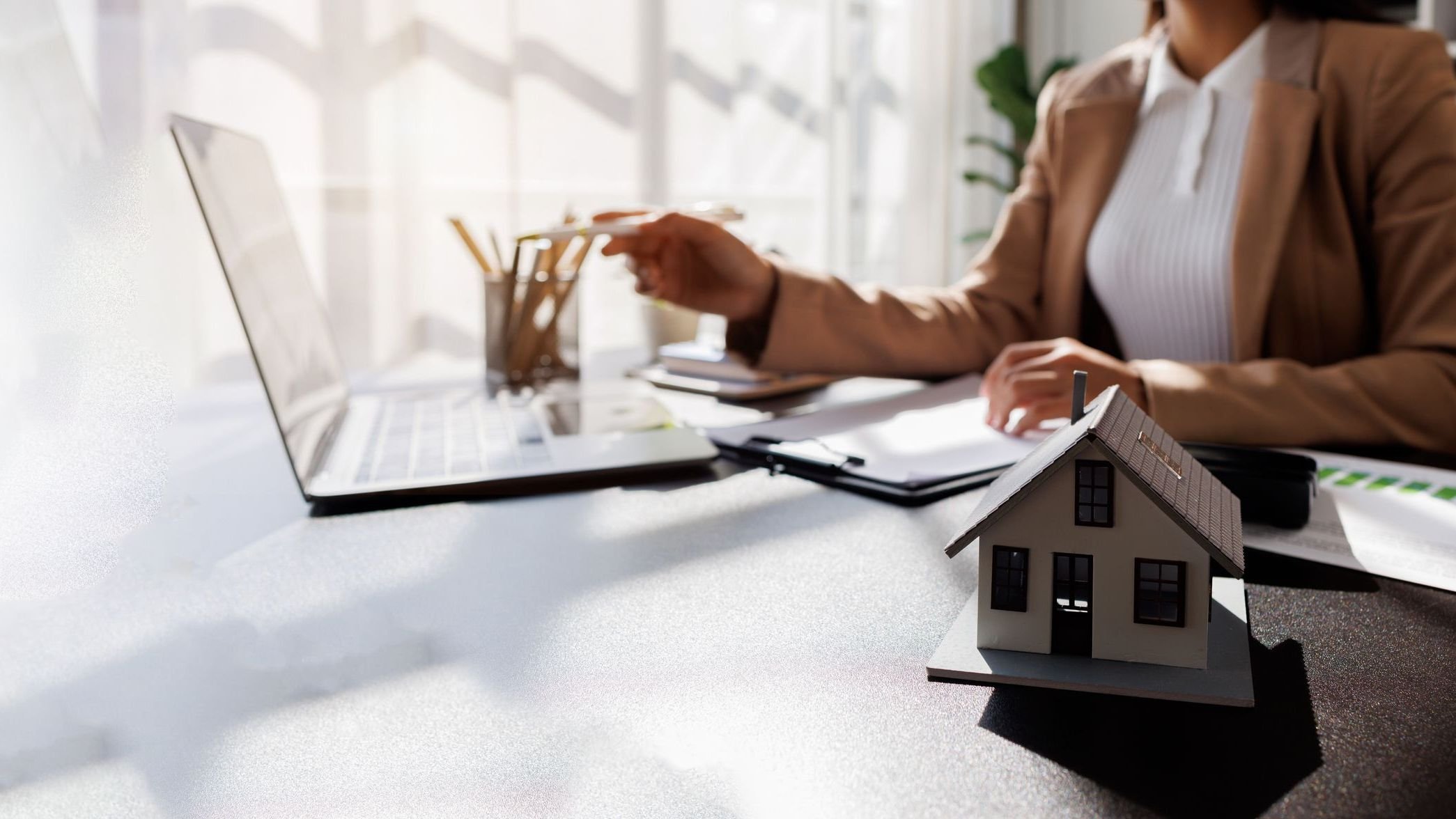 Real Estate Broker agent's signature on the contract finalized the mortgage agreement, marking a significant investment in the housing property for business purposes. 