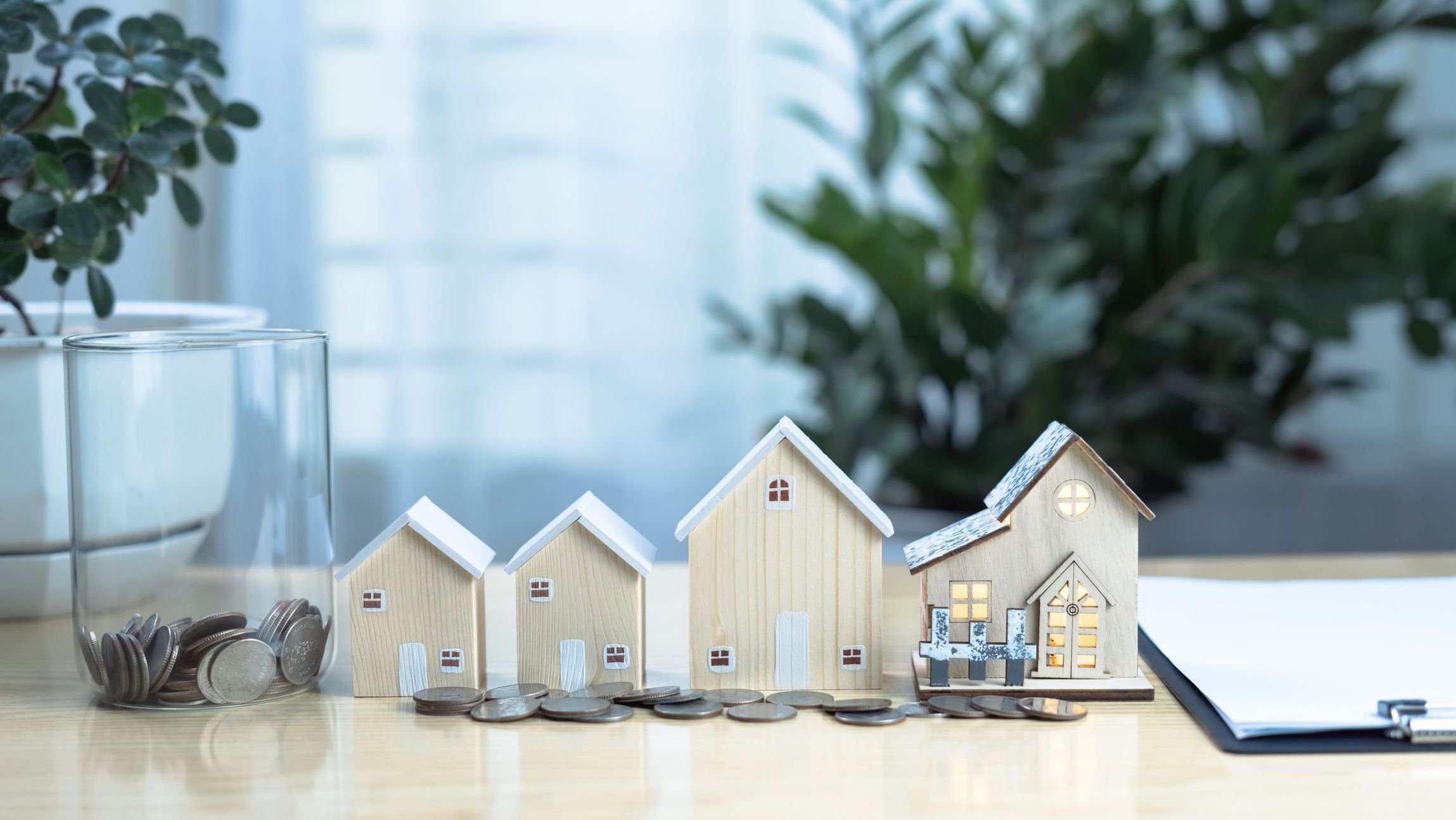 Real estate investment concept with virtual screen showing property transactions.