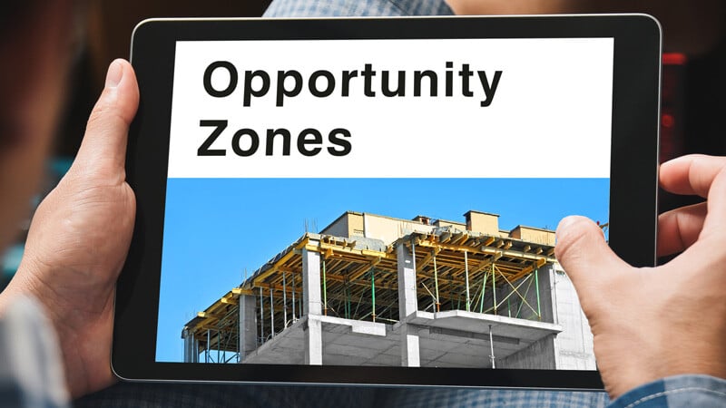A tablet with the words opportunity zones on it