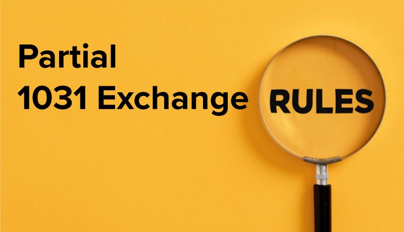 A picture showing the words partial 1031 exchange rules with a magnifying glass magnifying the word rules.