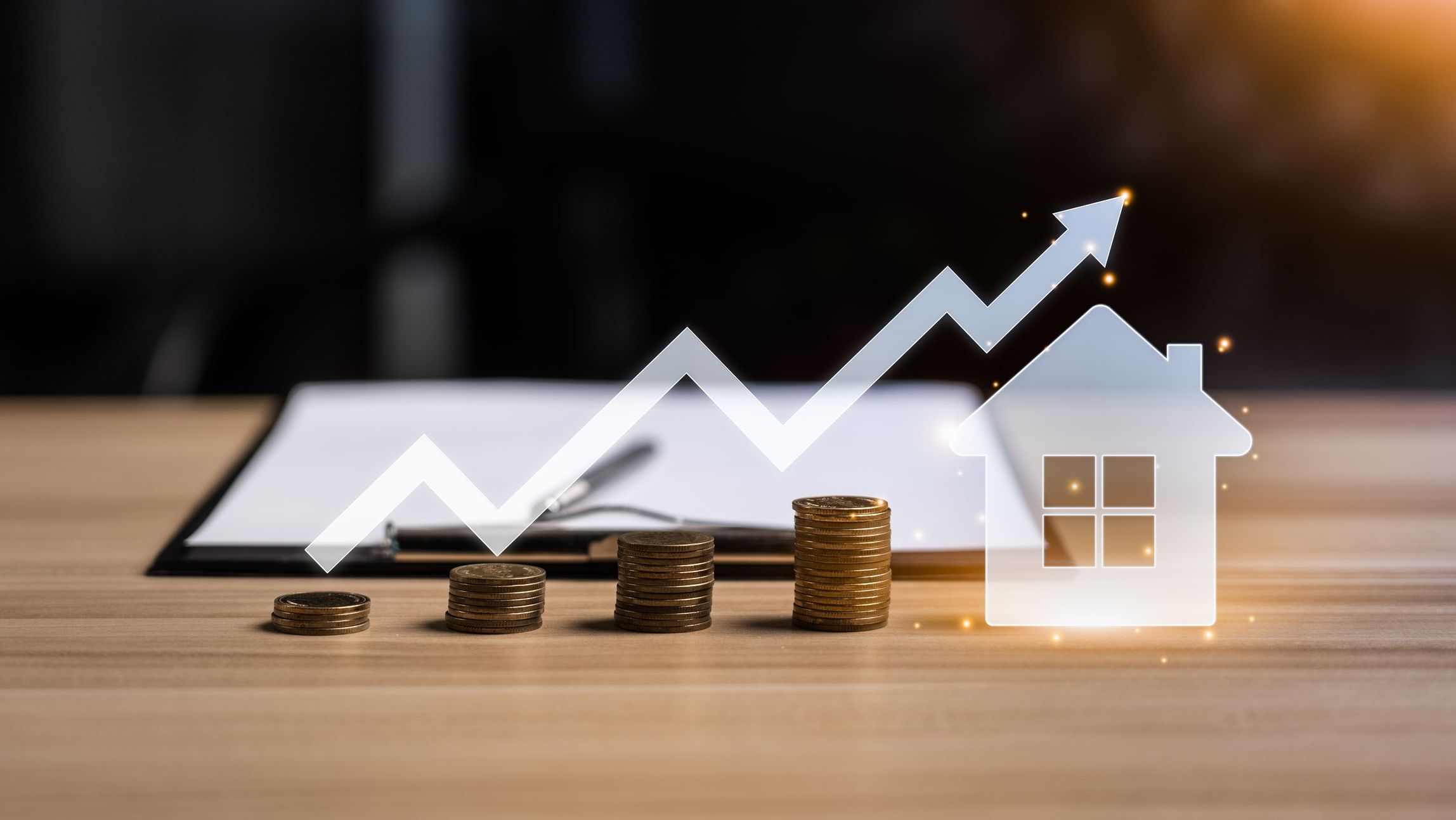 Real Estate Agent sells her home or real estate on her desk.
