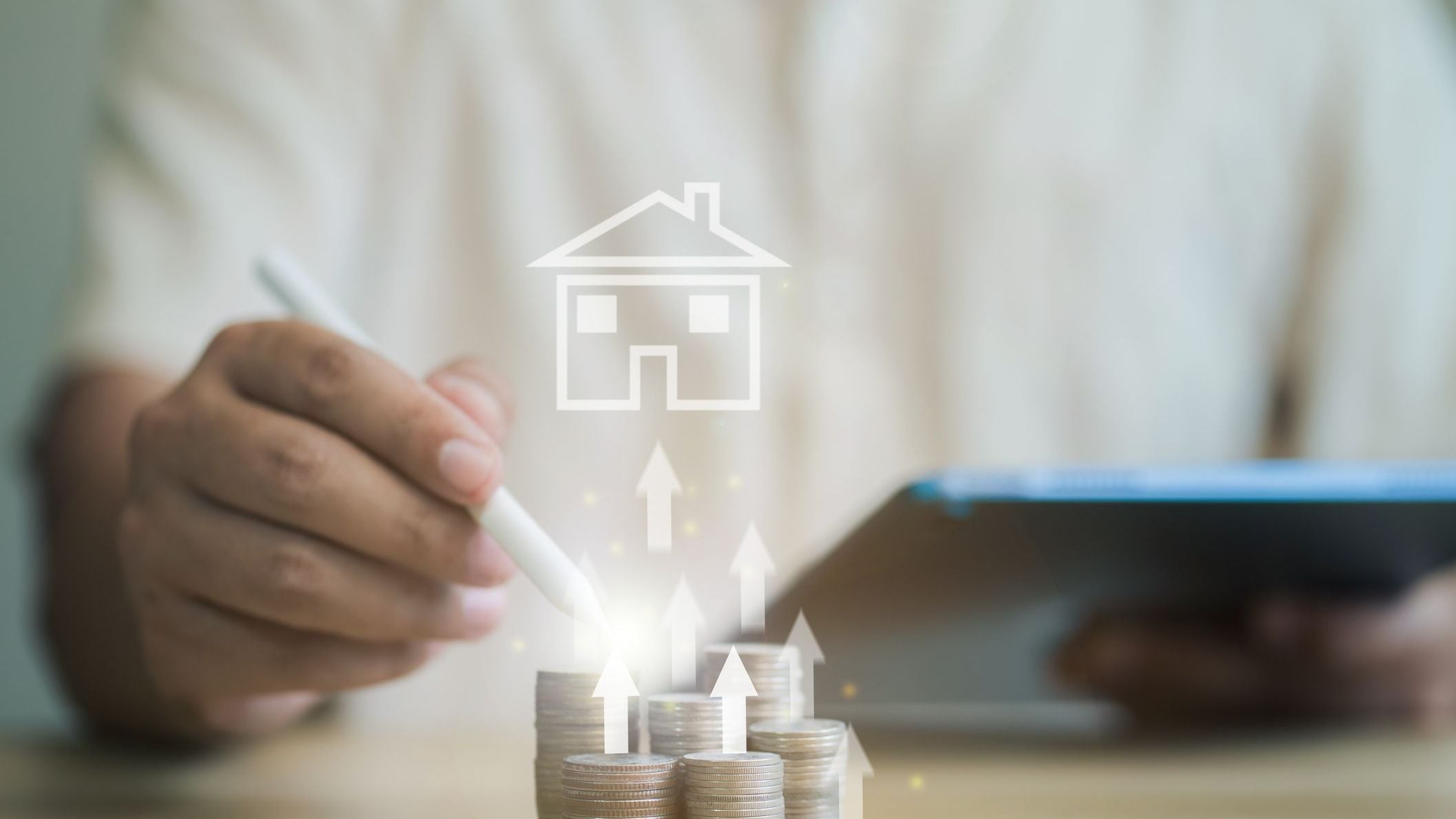 Businessman pointing at stack of coins in mock house with arrow pointing upwards Concept of saving money to buy a house Arrange the coins in a growing graph. 
