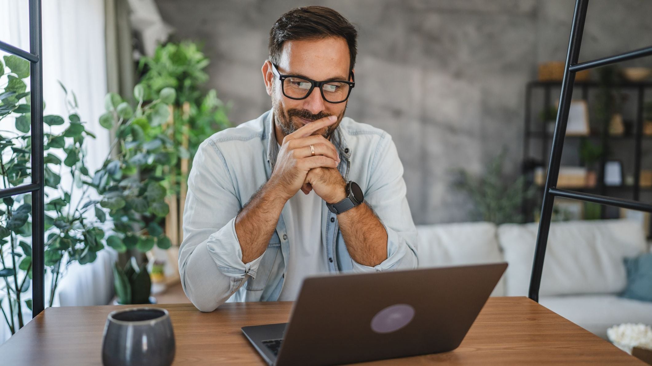 Adult caucasian with eyeglasses man use laptop at home
