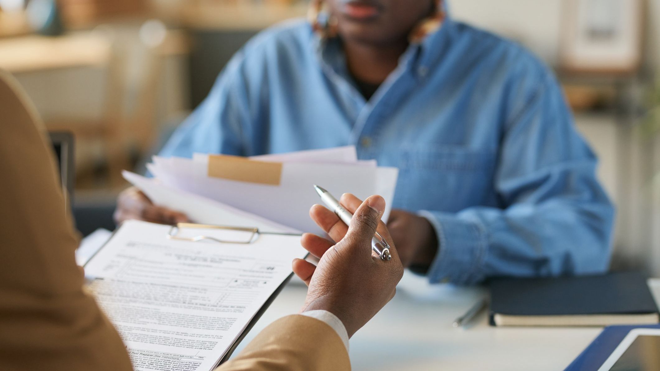Closeup of Black Man Discussing Taxes.