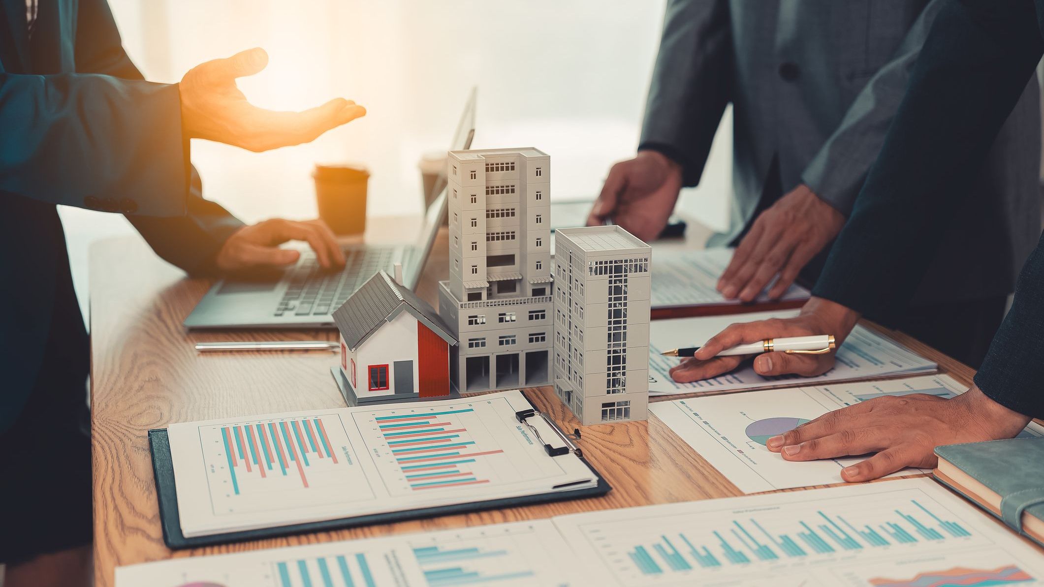 Real estate entrepreneurs meeting to sell a house.
