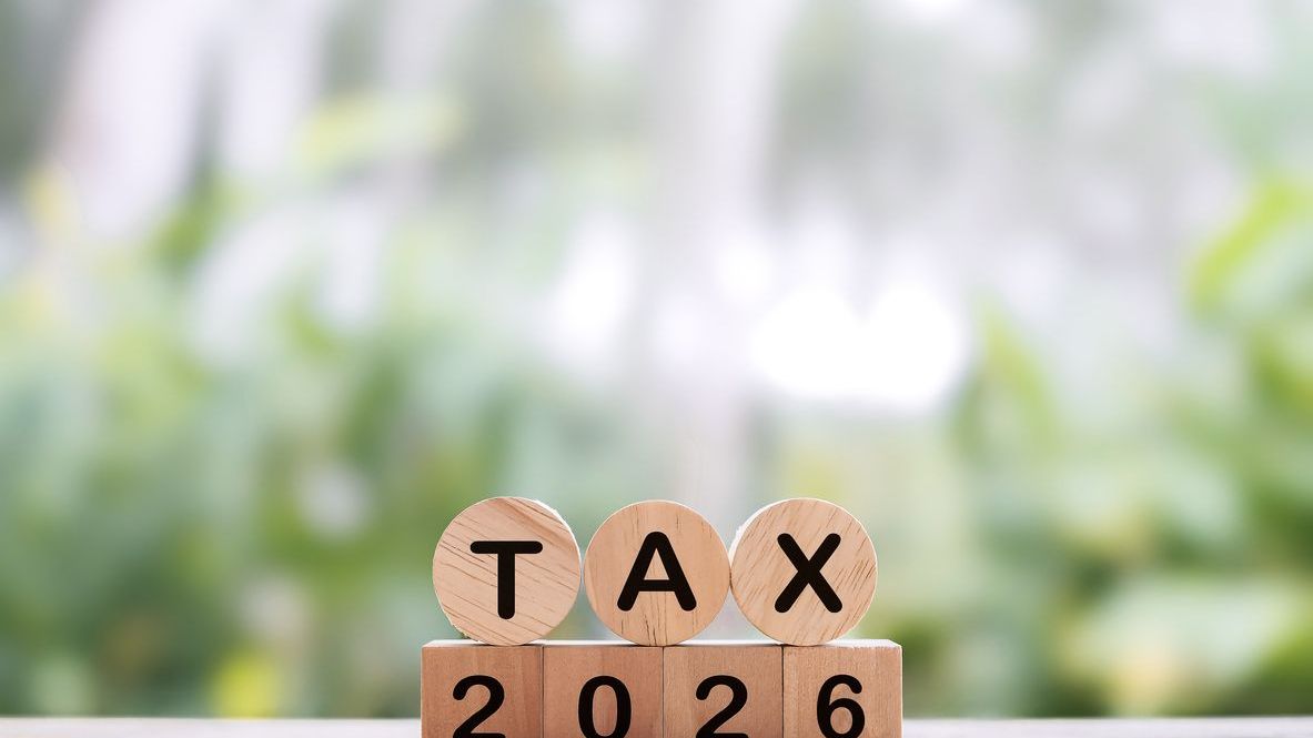 Wooden blocks with the word TAX and number 2026.